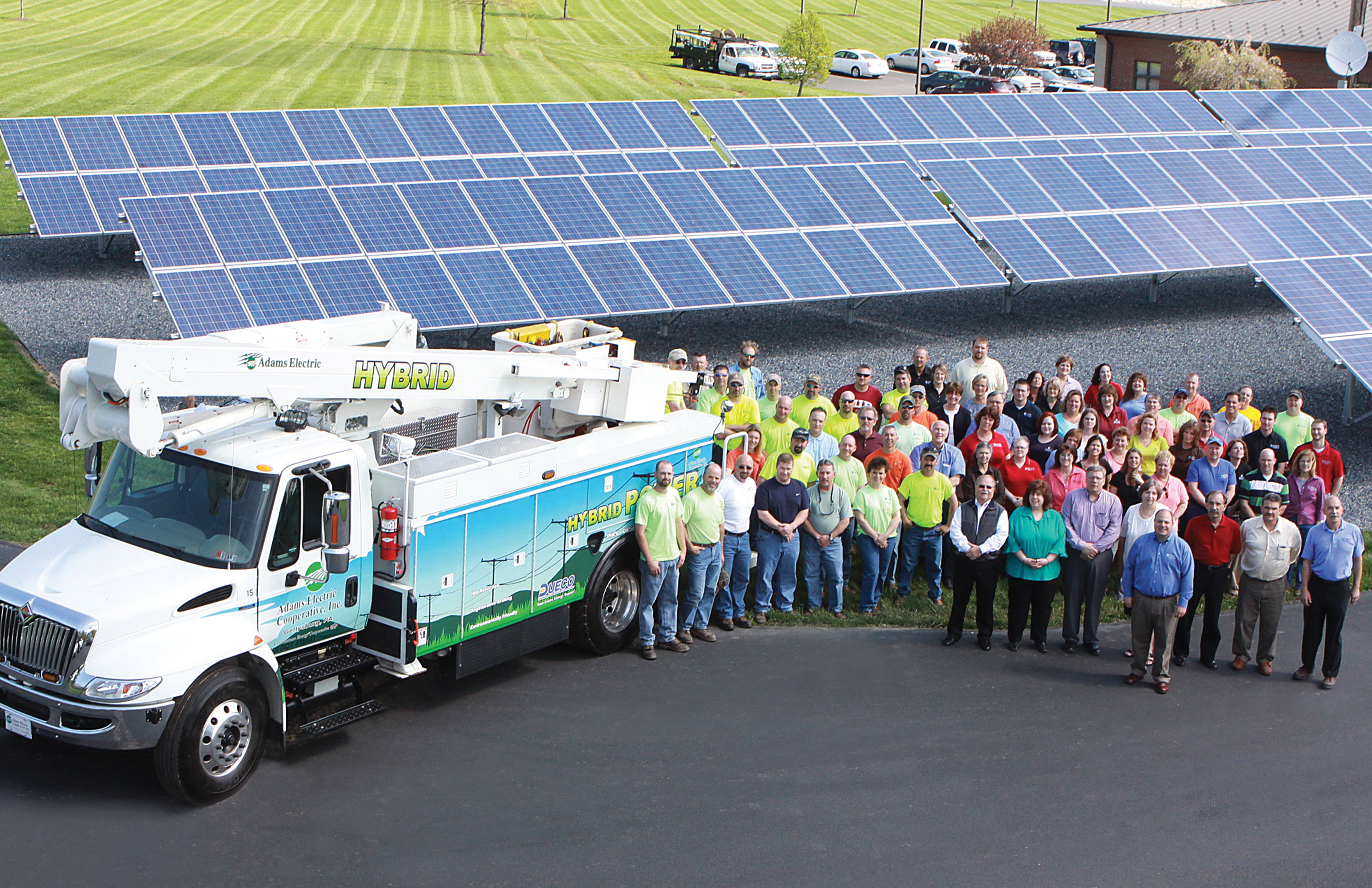 Adams Employees w truck & solar.jpg